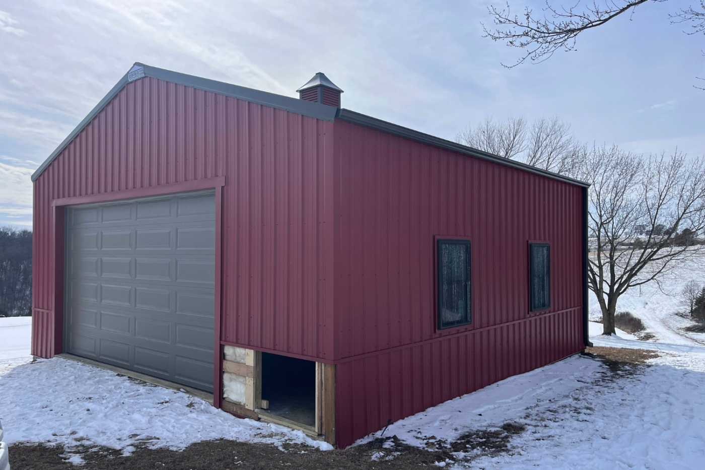 black and red building with new gutters and garage