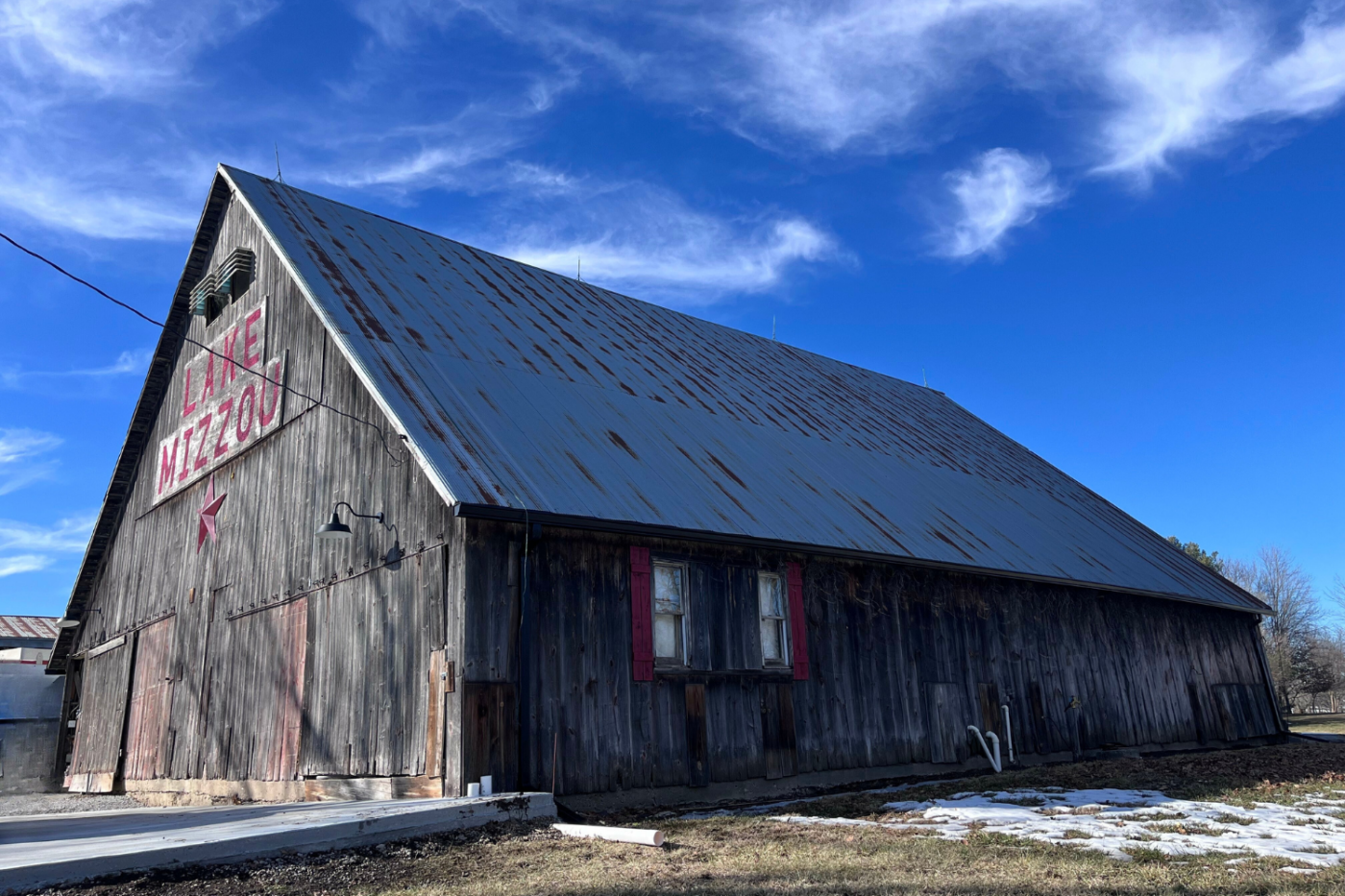 wooden building with new gutters